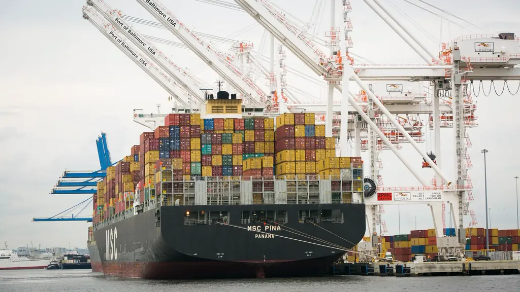 Container ship alongside cranes at a terminal
