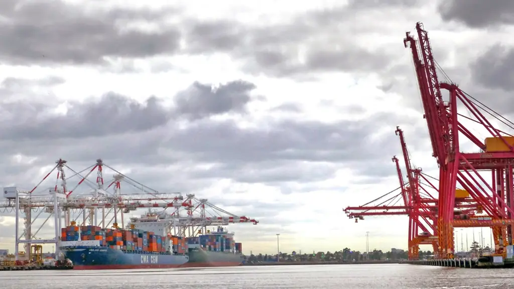 Container cranes under a cloudy sky