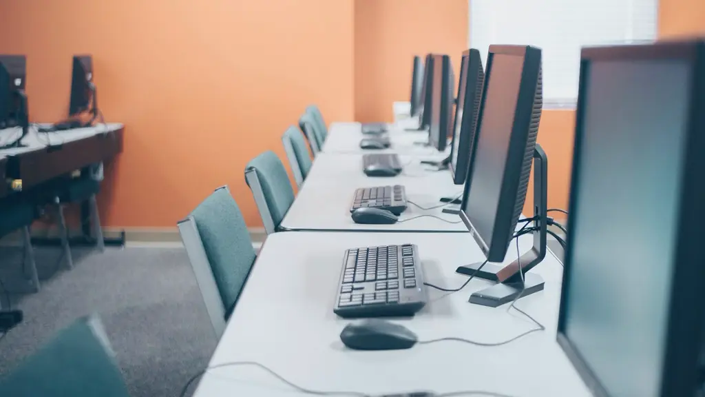 Row of desktop computers in an office