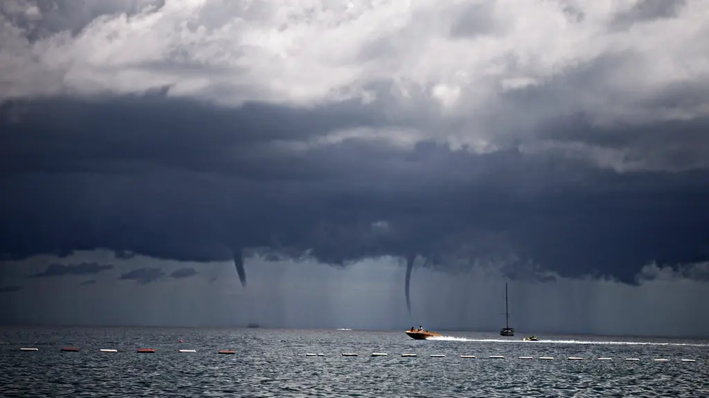 Storm clouds and waterspouts over the sea